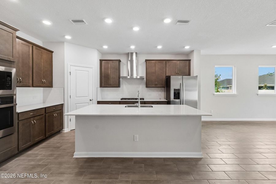 Furnished interior view inside a new home in Tributary 50', Yulee (Image 14).