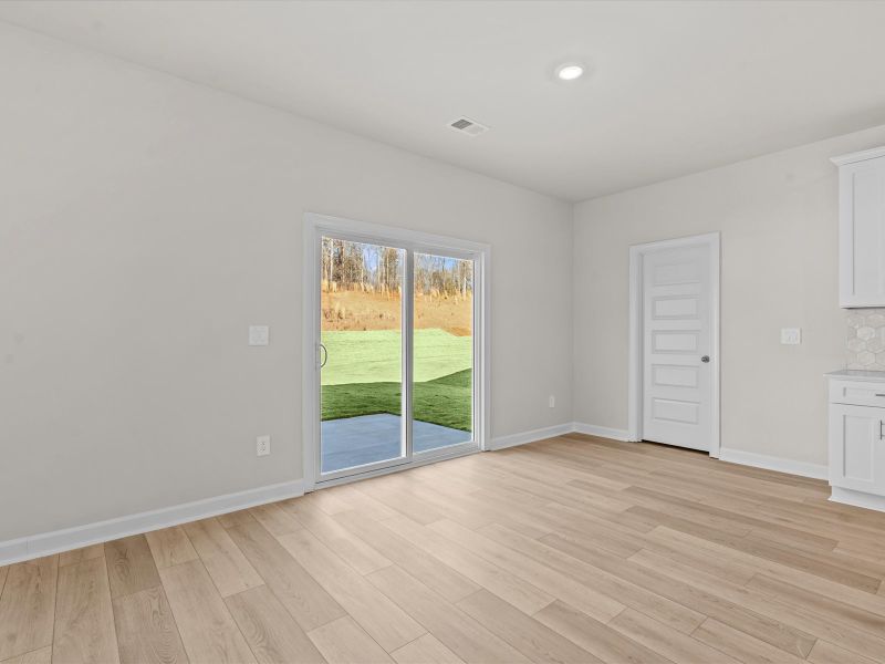 Spacious, unfurnished interior of a new home in The Farm at Wells Creek - Signature Collection, Gray Court (Image 10).