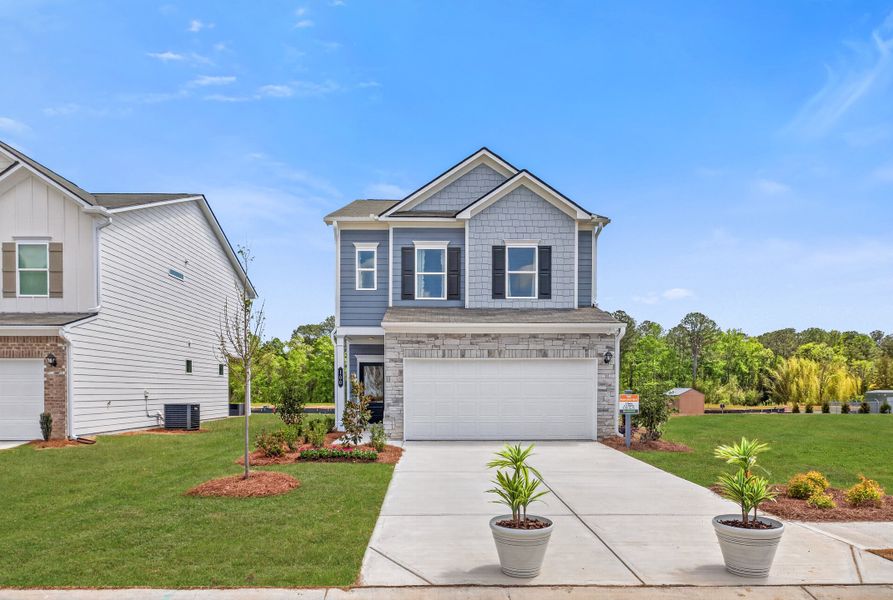Front exterior of a new home in The Andros, Dalton, GA, highlighting curb appeal (Image 1). Front exterior of a new home in The Andros, Dalton, GA, highlighting curb appeal (Image 1).