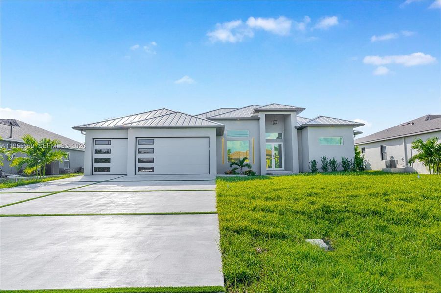 Front exterior of a new home in , Cape Coral, FL, highlighting curb appeal (Image 23). Front exterior of a new home in , Cape Coral, FL, highlighting curb appeal (Image 23).