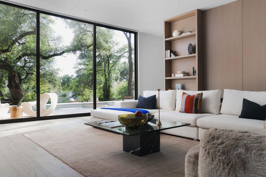 Living area featuring floor to ceiling windows and wood finished floors