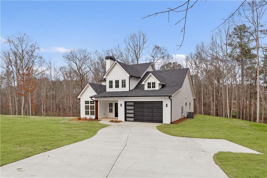 Front exterior of a new home in , Dallas, GA, highlighting curb appeal (Image 23).