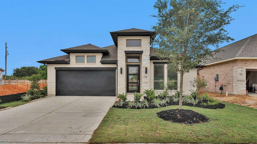 Front exterior of a new home in Candela South 50', Richmond, TX, highlighting curb appeal (Image 9).