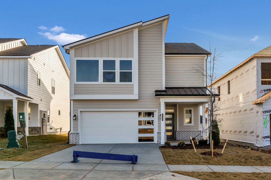 Front exterior of a new home in Nexus – Park Collection, Gallatin, TN, highlighting curb appeal (Image 18).