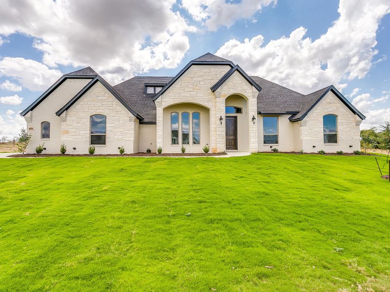 Representative exterior photo of a completed home built from the 091-2403-0617 by Abba River Homes in Stanford Estates, Springtown, TX (Image 1).