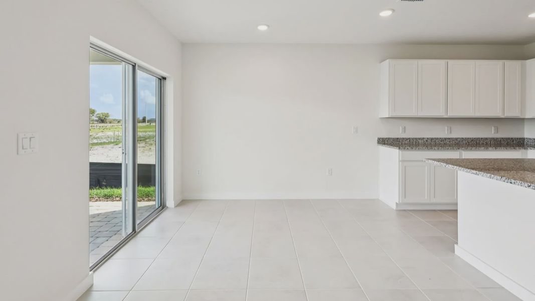 Dining and Living Area of the Baker Floor Plan by DRB Homes in Liberty Trace New Homes in Haines City