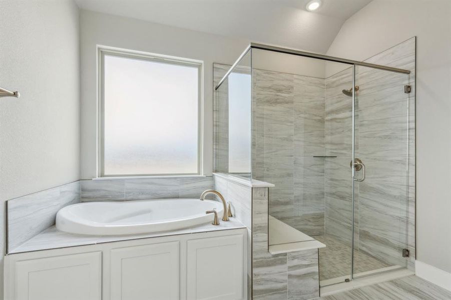 Bathroom with vaulted ceiling and plus walk in shower