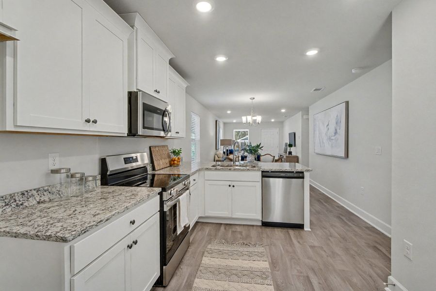 Representative furnished interior of a home built from the Plan 1250 by Adams Homes in Turtle Creek, Cantonment (Image 13).