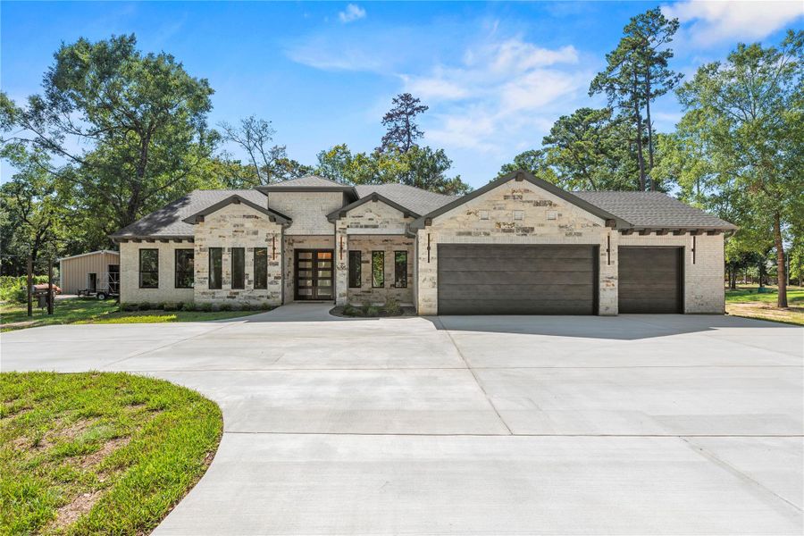 Front exterior of a new home in , Magnolia, TX, highlighting curb appeal (Image 2). Front exterior of a new home in , Magnolia, TX, highlighting curb appeal (Image 2).