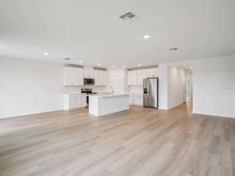 Spacious, unfurnished interior of a new home in The Grove at Stuart Crossing - Classic Series, Bartow (Image 12).