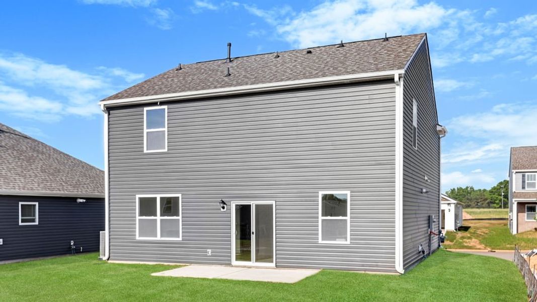 Exterior details and patio area of a home in Durbin Meadows Traditions, Fountain Inn (Image 4).