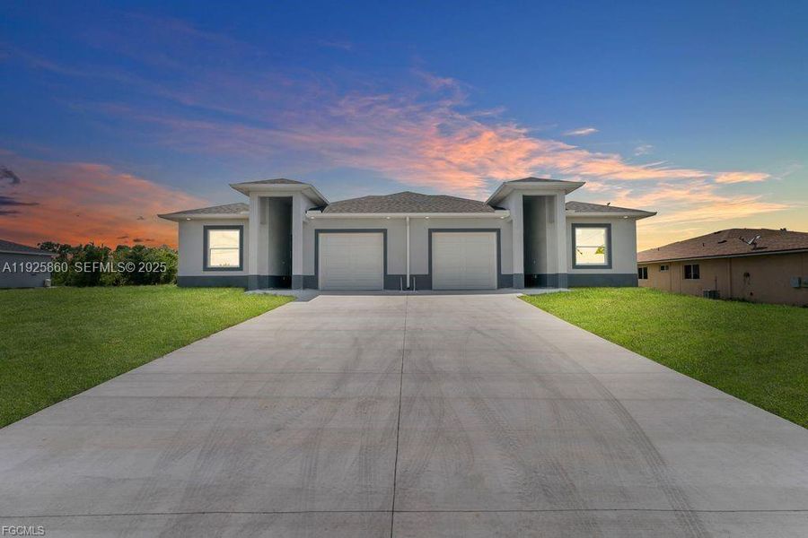 Front exterior of a new home in , Lehigh Acres, FL, highlighting curb appeal (Image 27).