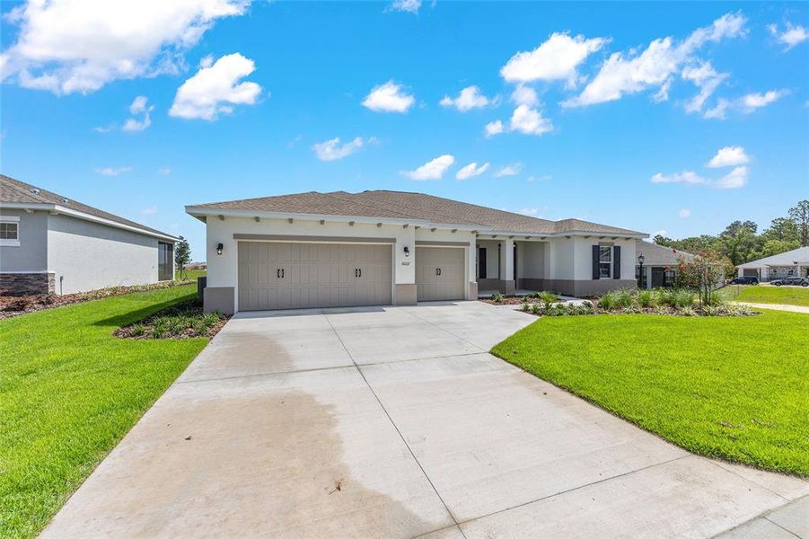 Front exterior of a new home in On Top of the World Communities, Ocala, FL, highlighting curb appeal (Image 21).