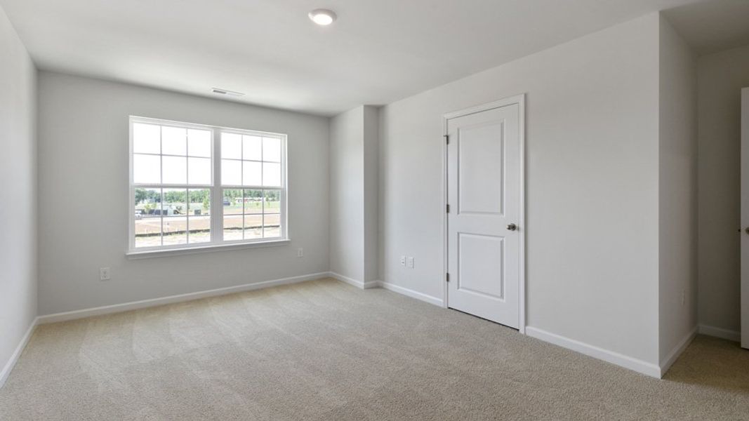 Spacious, unfurnished interior of a new home in The Townes at Bexford, Willow Spring (Image 11).
