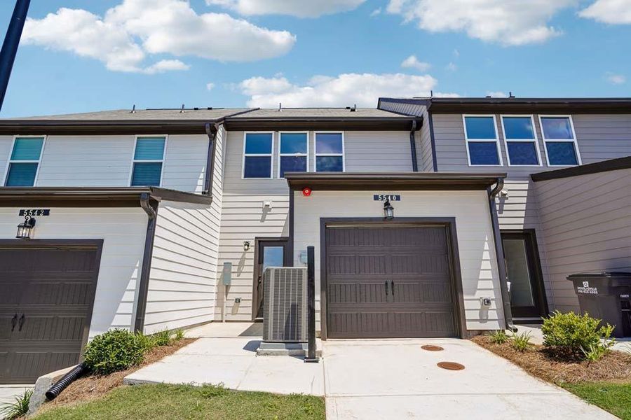 Front exterior of a new home in Laurelwood, Douglasville, GA, highlighting curb appeal (Image 18). Front exterior of a new home in Laurelwood, Douglasville, GA, highlighting curb appeal (Image 18).