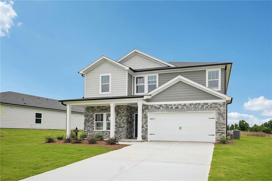 Front exterior of a new home in Northwoods at Mirror Lake, Villa Rica, GA, highlighting curb appeal (Image 1). Front exterior of a new home in Northwoods at Mirror Lake, Villa Rica, GA, highlighting curb appeal (Image 1).