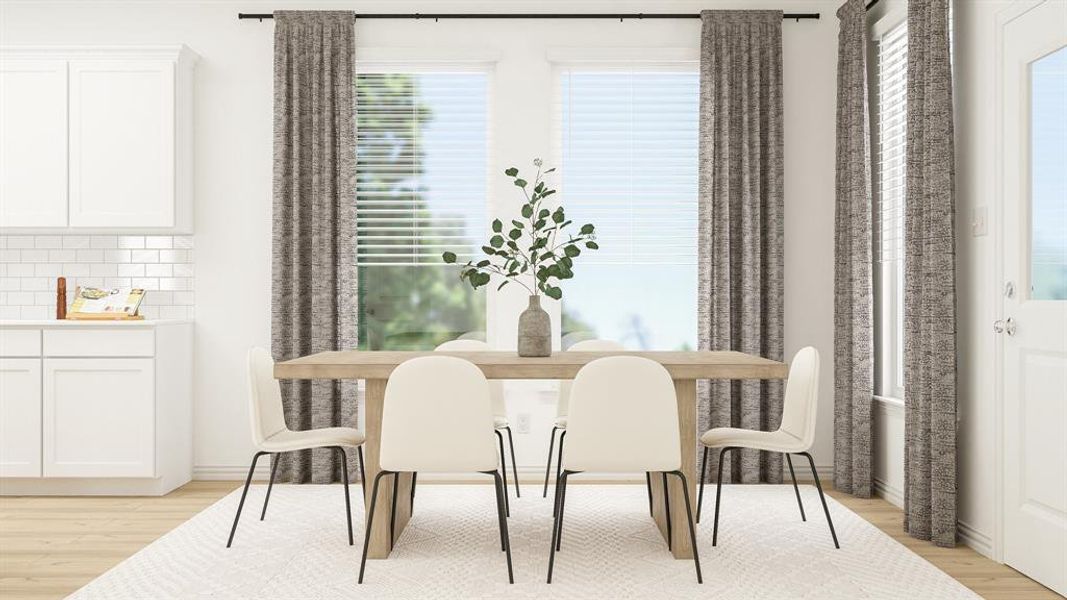 Dining space featuring light wood-type flooring