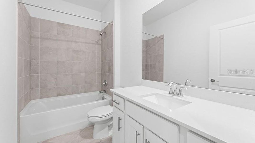Furnished interior view inside a new home in Palm Lake at Coco Bay, Englewood (Image 10).