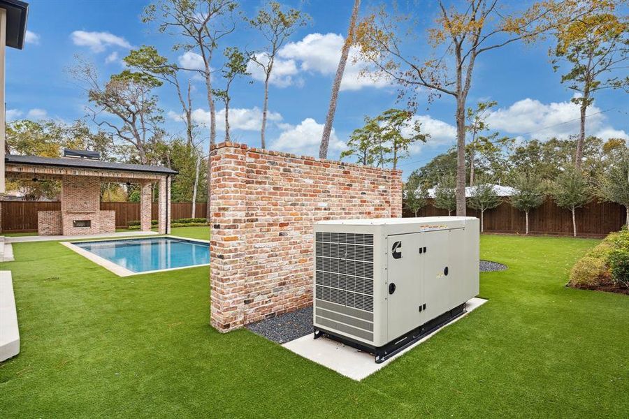 A whole-home generator ensures you're always prepared, seamlessly blending into the landscape behind a beautifully crafted brick wall.