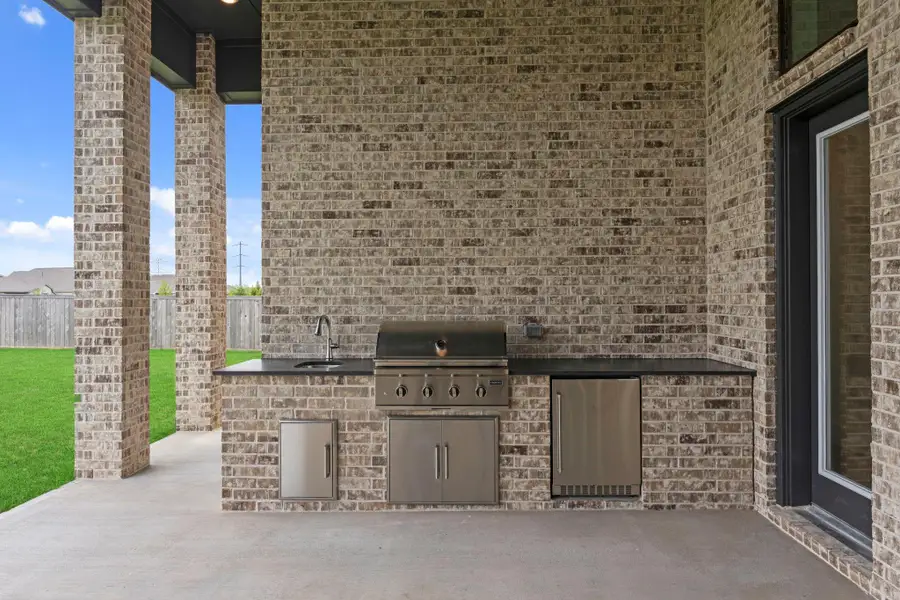 Back door leading out to your covered patio and outdoor kitchen. Representative image.