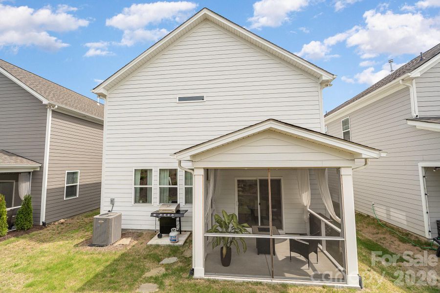 Exterior details and patio area of a home in Village at North Reach, Charlotte (Image 29).