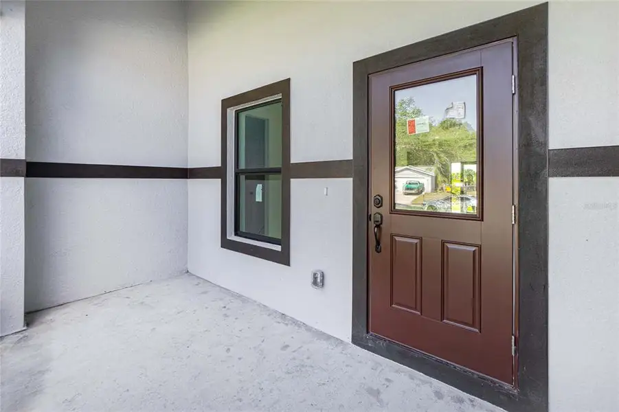 Exterior details and patio area of a home in , Port Charlotte (Image 32).