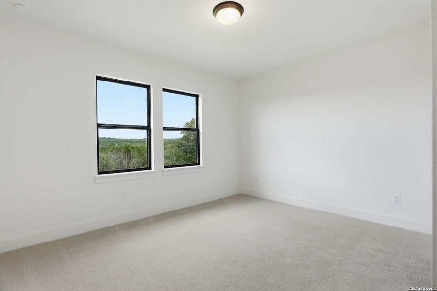 Spacious, unfurnished interior of a new home in Enchanted Bluff, San Antonio (Image 27).
