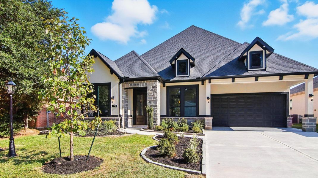 Front exterior of a new home in , Montgomery, TX, highlighting curb appeal (Image 21). Front exterior of a new home in , Montgomery, TX, highlighting curb appeal (Image 21).