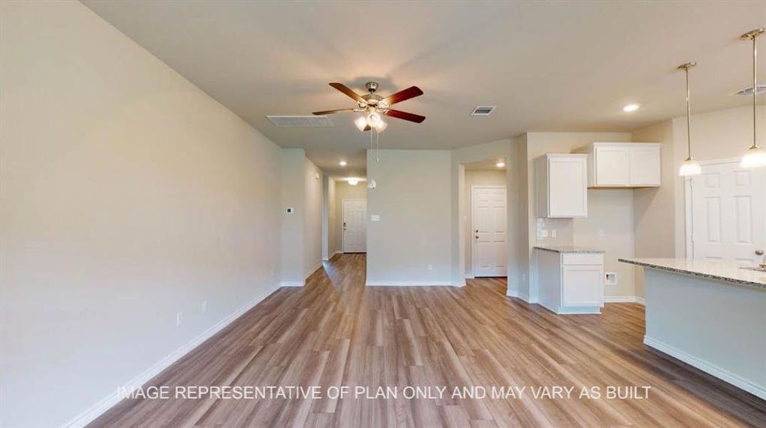 Unfurnished living room with light wood-style flooring, recessed lighting, and a ceiling fan Unfurnished living room with light wood-style flooring, recessed lighting, and a ceiling fan