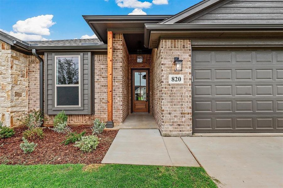 Entrance to property with a garage