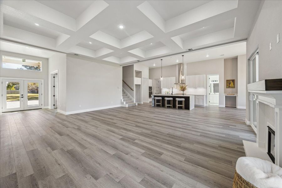 No expense spared in the attention to detail and Architectural elements of this gorgeous home! The Great Room has Box Coffered Ceiling, separately wired for a Chandelier or Ceiling Fan if desired. Full LED Recessed Lighting in each Box.  Wonderful neutral palate awaits your Designer touches, but the elements are enough by themselves if you chose light and bright