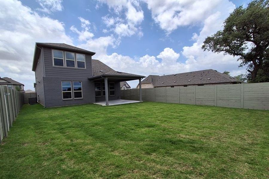 Exterior details and patio area of a home in Wolf Ranch, Georgetown (Image 2). Exterior details and patio area of a home in Wolf Ranch, Georgetown (Image 2).