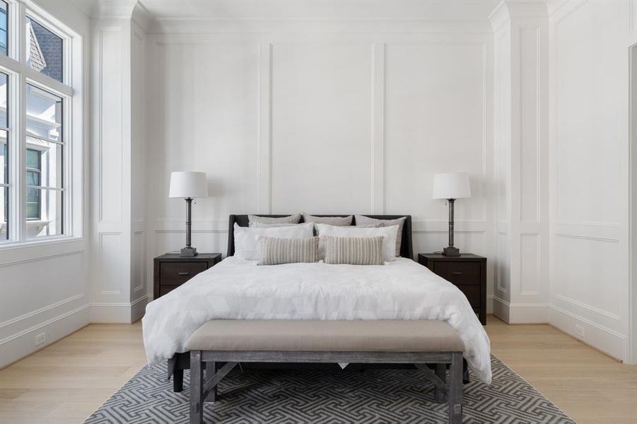 Intricate details such as floor-to-ceiling trim detailing, oversize windows, and custom stained hardwoods create a warm and peaceful retreat. (photo of interior model home with smaller floor plan)