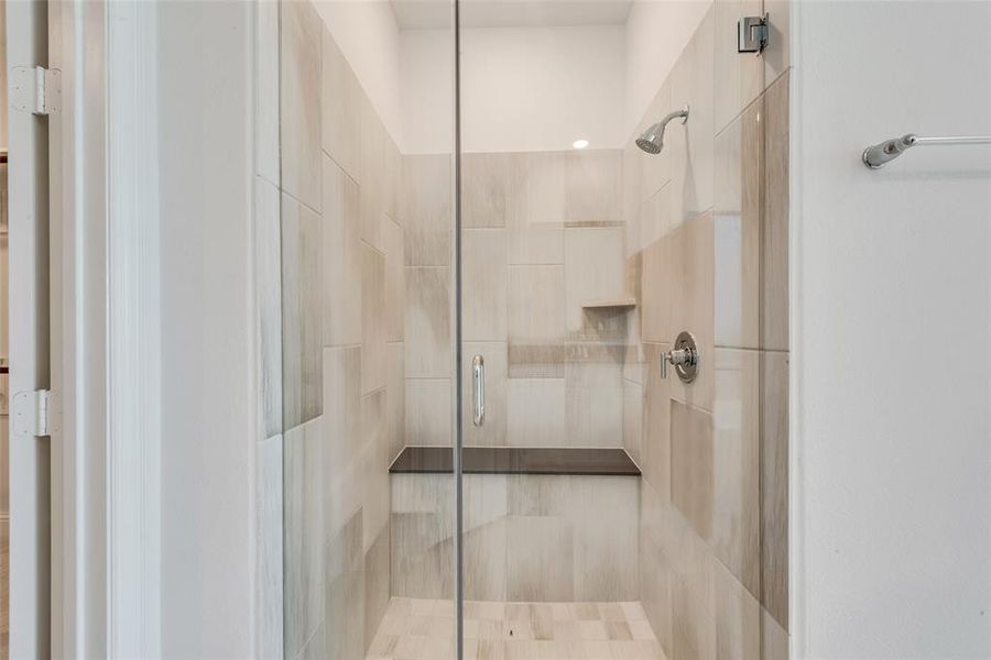 Bathroom with a shower with shower door