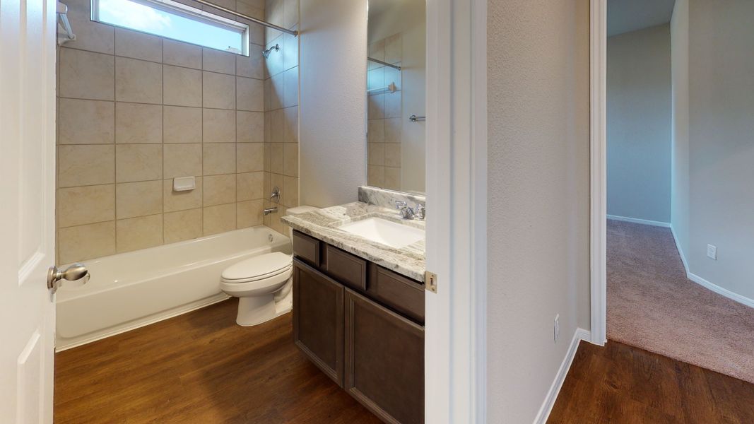 Representative furnished interior of a home built from the Floor Plan 3256 by Colina Homes in Grand Magnolia, Magnolia (Image 19).