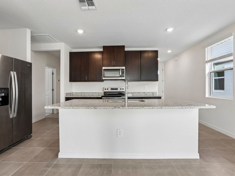 Furnished interior view inside a new home in Benton Hills - Premier Series, Brooksville (Image 5).