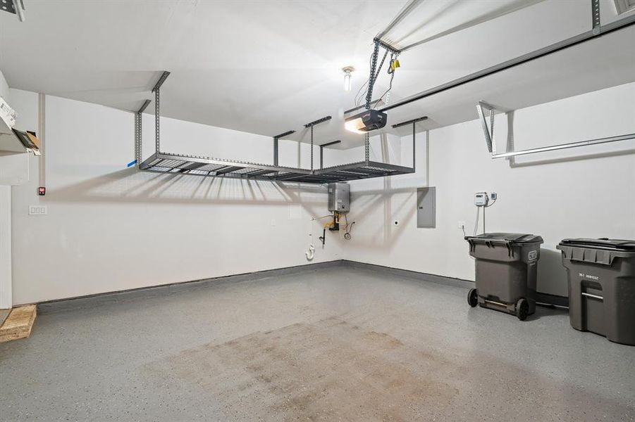 Spacious garage with an epoxy-coated concrete floor Spacious garage with an epoxy-coated concrete floor