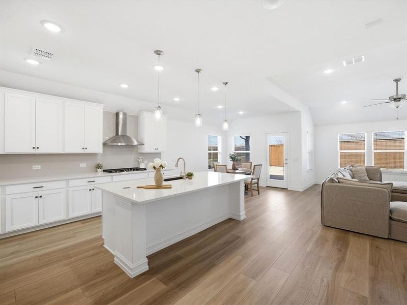 Kitchen view of single story three bedroom home with an office and a formal dining room
