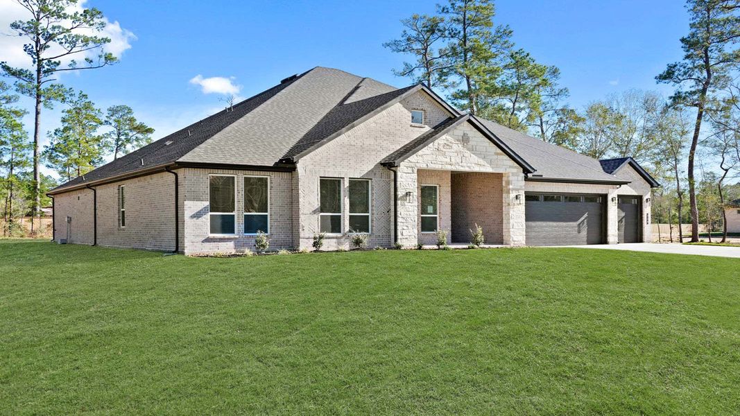 Front exterior of a new home in Butlers Bend Estates, Pinehurst, TX, highlighting curb appeal (Image 19).