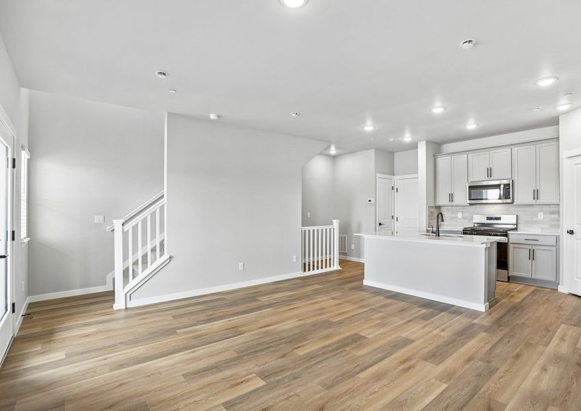The family room is spacious and near the kitchen.