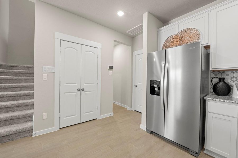 The stairway is tucked away, to not disrupt the open flow of this home. The stairway is tucked away, to not disrupt the open flow of this home.