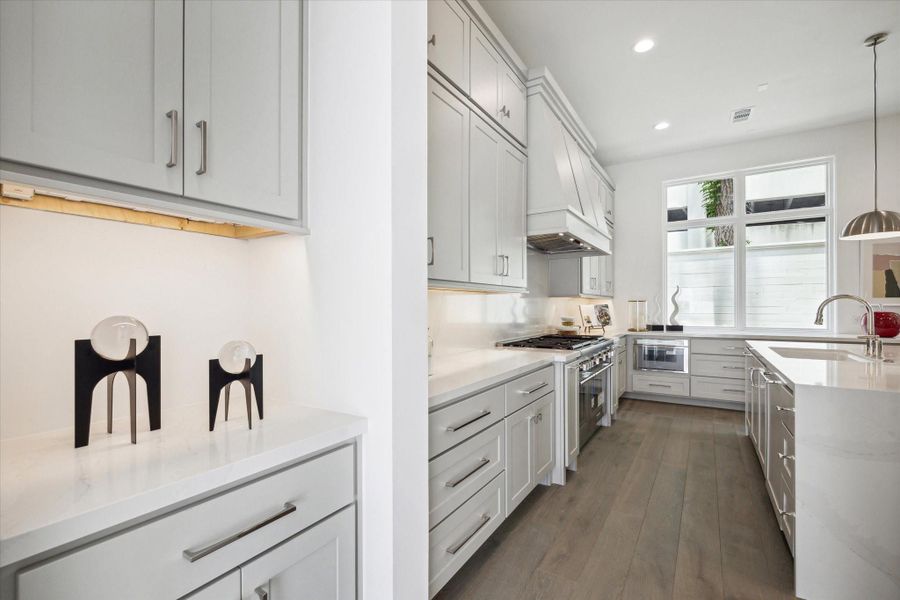 This drop zone can be found between garage and kitchen. With hooks, a bench, and storage cabinet, this space functions perfectly as a transition space. This drop zone can be found between garage and kitchen. With hooks, a bench, and storage cabinet, this space functions perfectly as a transition space.