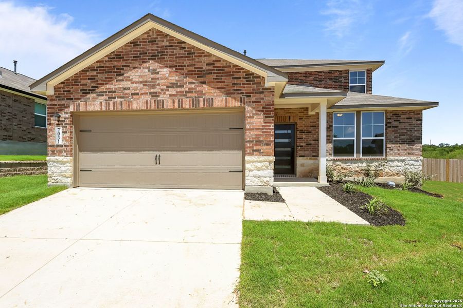 Front exterior of a new home in Comanche Ridge, San Antonio, TX, highlighting curb appeal (Image 20). Front exterior of a new home in Comanche Ridge, San Antonio, TX, highlighting curb appeal (Image 20).