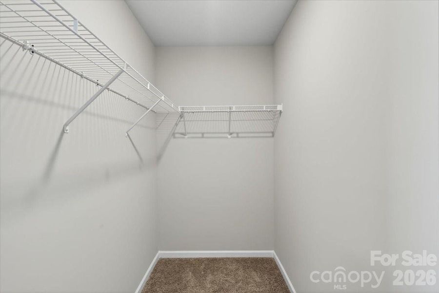 Primary Walk-in Closet Primary Walk-in Closet