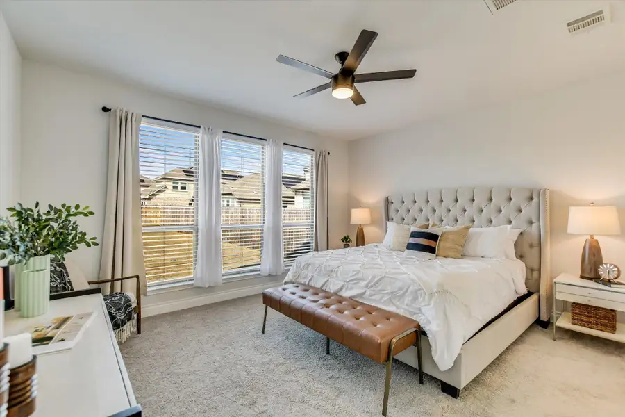 Large downstairs primary with views of the sunset from your bed