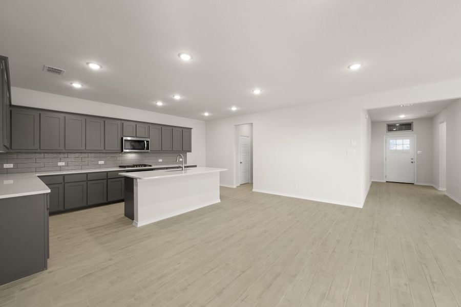 Front exterior of a new home in Myrtle Creek, Waxahachie, TX, highlighting curb appeal (Image 12). Front exterior of a new home in Myrtle Creek, Waxahachie, TX, highlighting curb appeal (Image 12).