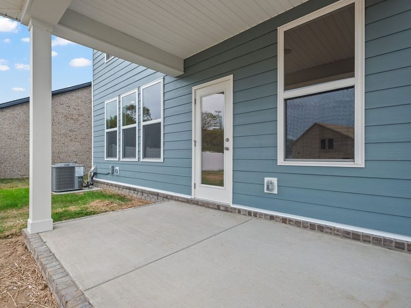 Exterior details and patio area of a home in Woods Crossing, Gallatin (Image 25).