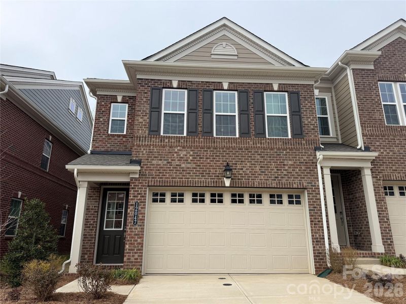 Front exterior of a new home in The Townes at Wade Ardrey, Charlotte, NC, highlighting curb appeal (Image 1). Front exterior of a new home in The Townes at Wade Ardrey, Charlotte, NC, highlighting curb appeal (Image 1).