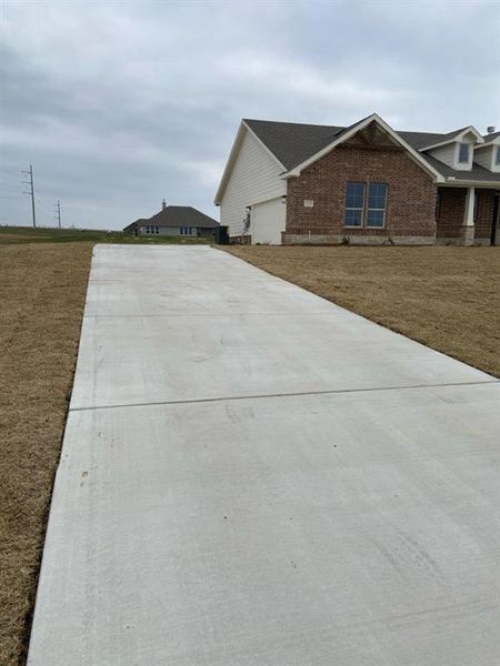 Front exterior of a new home in Hillview Addition, Decatur, TX, highlighting curb appeal (Image 2). Front exterior of a new home in Hillview Addition, Decatur, TX, highlighting curb appeal (Image 2).