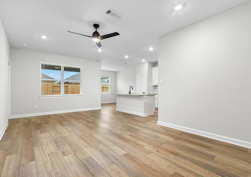 The kitchen overlooks the spacious living area.